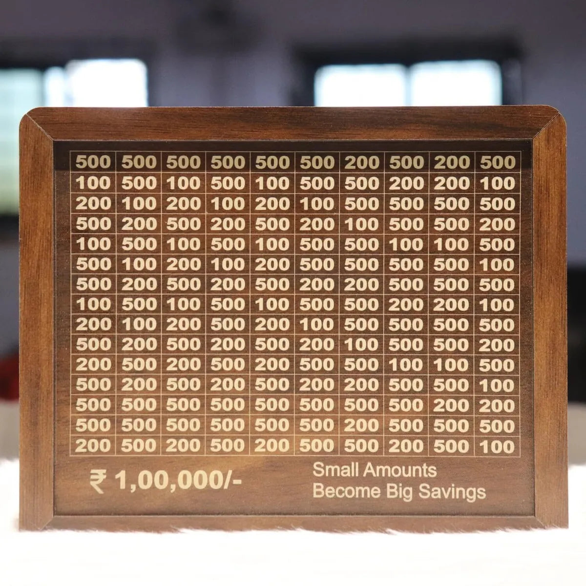 Wooden daily savings bank with chart for Rs 100000